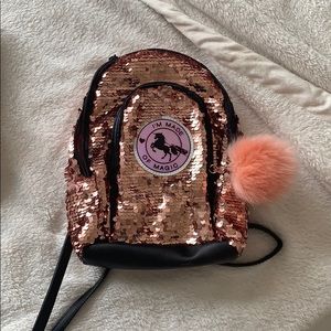 a pink justice bag “im made of magic”